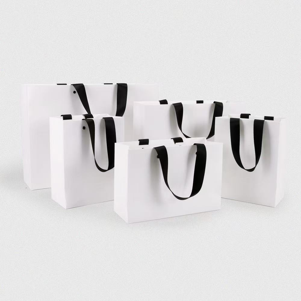 Factory Wholesale Customized Luxury Shopping Boutique Craft Gift Carrying Clothing and Shoes Packaging Paper Bags with Your logo