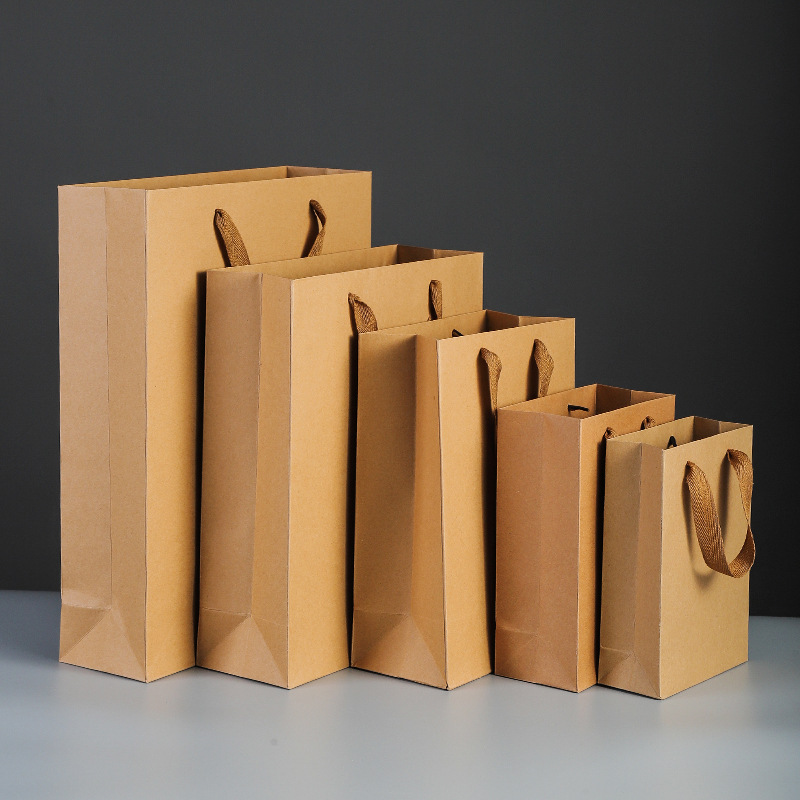 Wholesale Luxury Gift Printed Kraft Handle Paper Bag  Retail Clothing Brand logo Customized Shopping Packaging Paper Bag